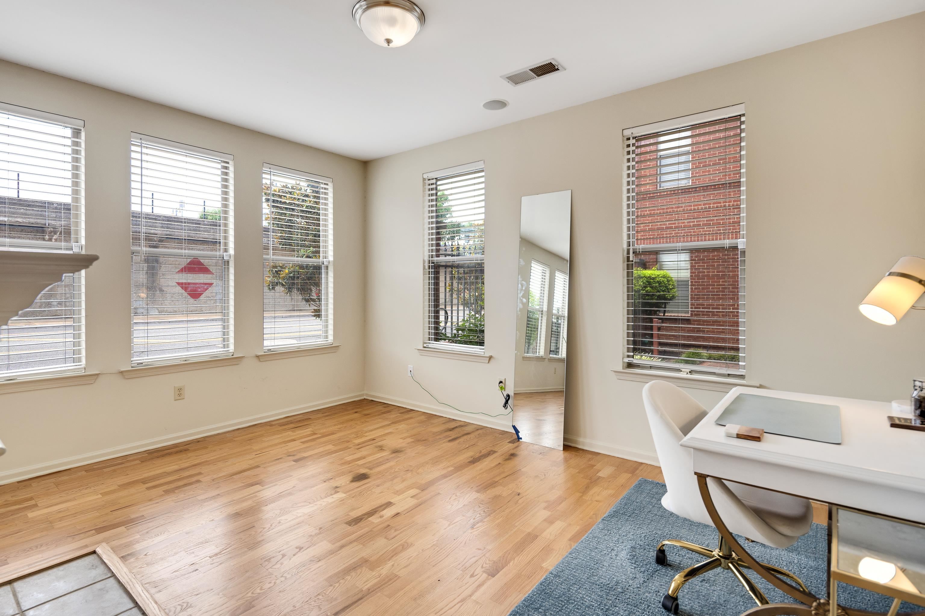 600 South Main Street, Unit 101 Memphis, TN 38103 - Photo 16 of 35 a bedroom with furniture and windows