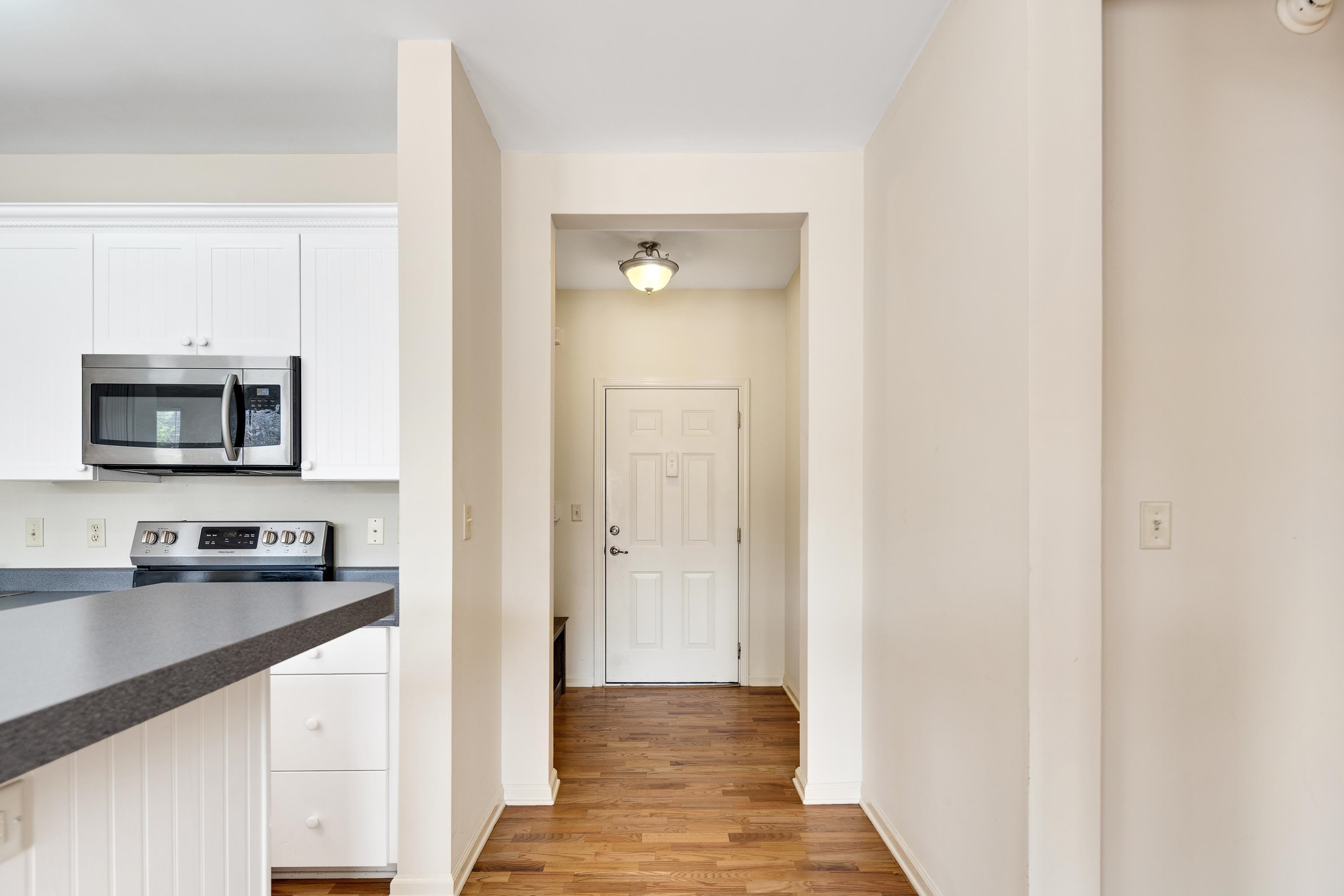 600 South Main Street, Unit 101 Memphis, TN 38103 - Photo 6 of 35 a kitchen with a refrigerator and a sink
