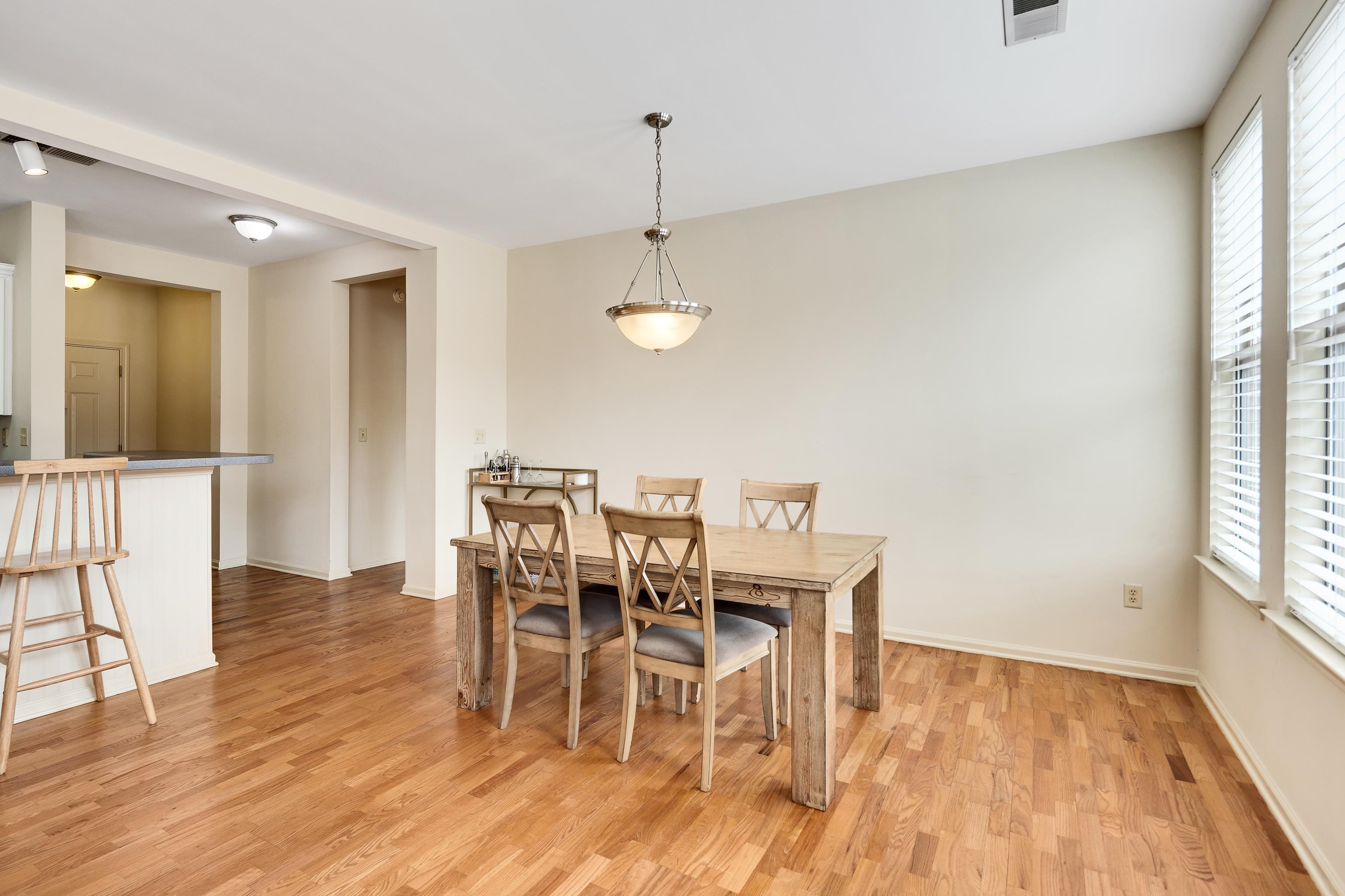 600 South Main Street, Unit 101 Memphis, TN 38103 - Photo 10 of 35 a view of a dining room with furniture window and wooden floor