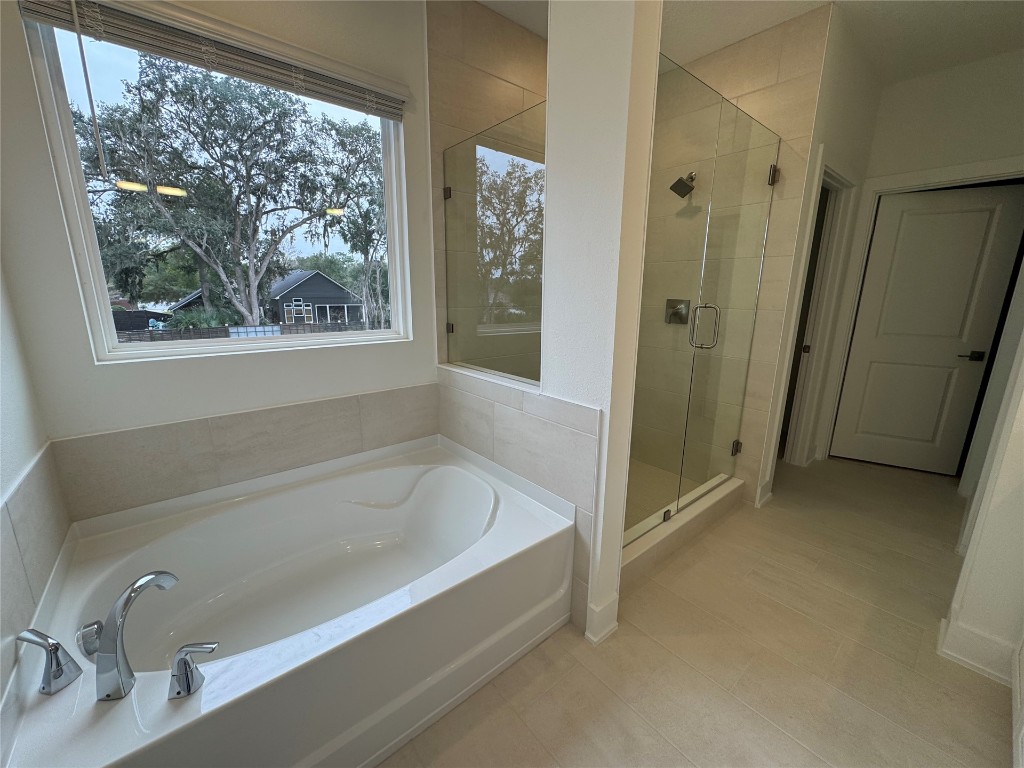 96160 Pirates Bluff Road Yulee, FL 32097 - Photo 6 of 8 a bathroom with a bathtub and a shower