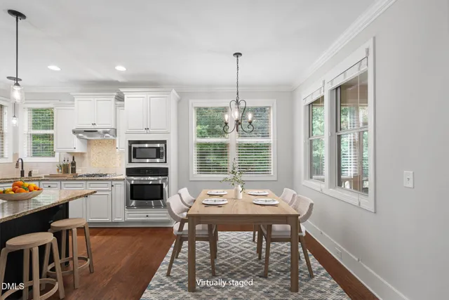 a bathroom with a sink toilet and mirror