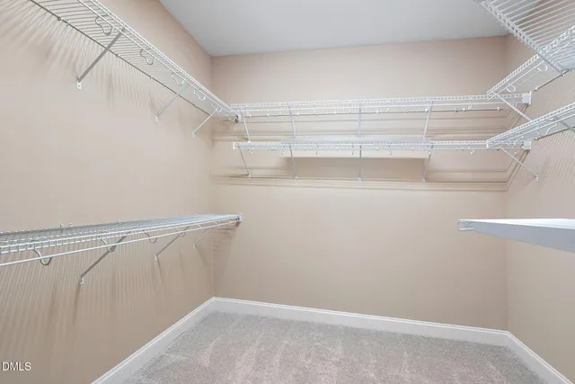a bathroom with a double vanity sink mirror and shower