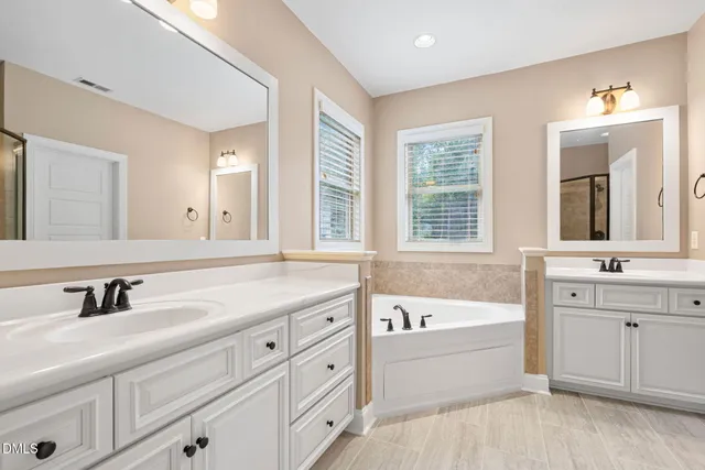 a white toilet sitting next to a bathroom sink
