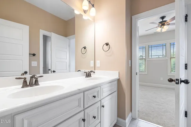 an aerial view of residential houses with outdoor space and swimming pool