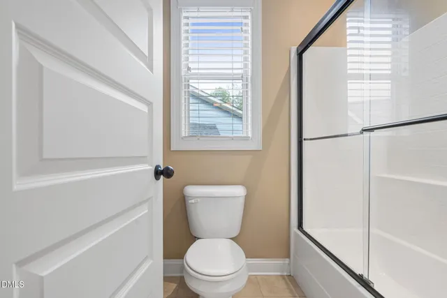 an aerial view of a house with a yard and swimming pool