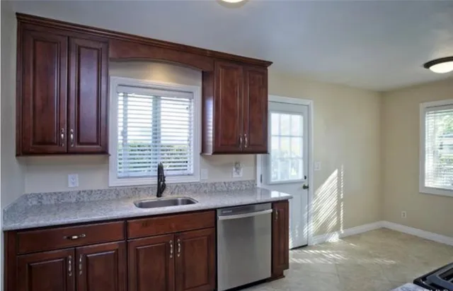 a kitchen with sink and window