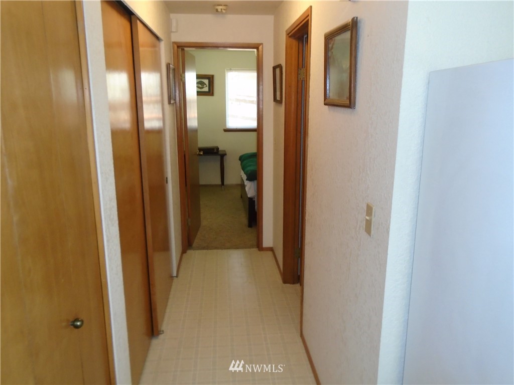 6219 Yeazell Road Southwest Longbranch, WA 98351 - Photo 11 of 27 a view of a bathroom from a hallway