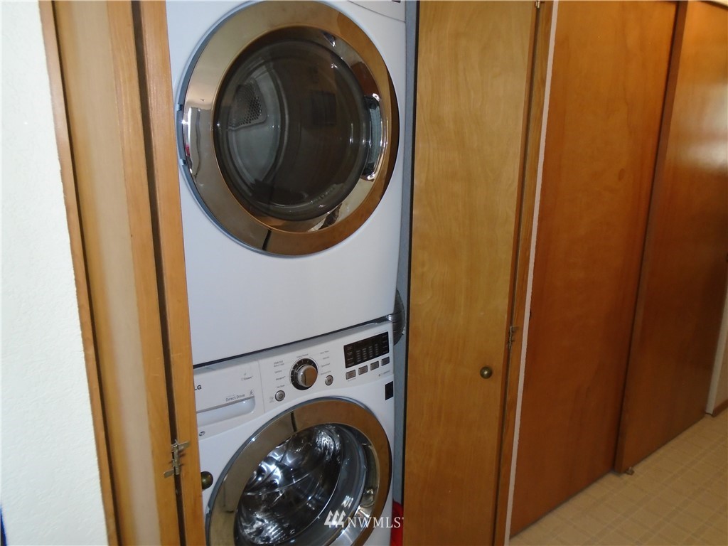6219 Yeazell Road Southwest Longbranch, WA 98351 - Photo 12 of 27 a utility room with dryer and washer