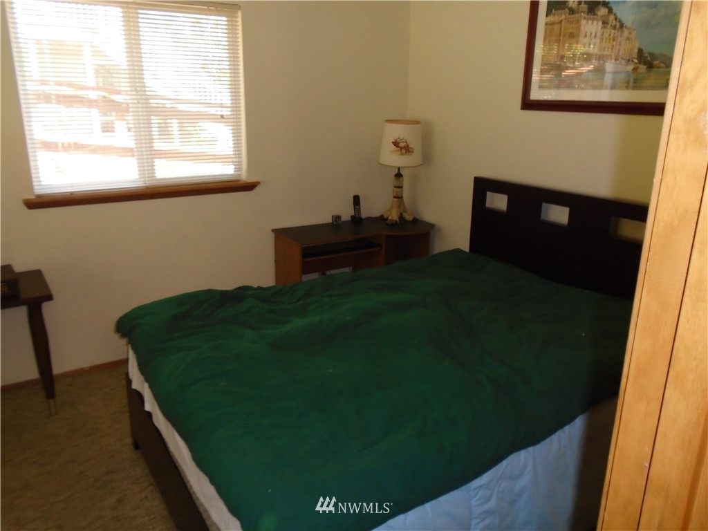 6219 Yeazell Road Southwest Longbranch, WA 98351 - Photo 14 of 27 a room with furniture and a window