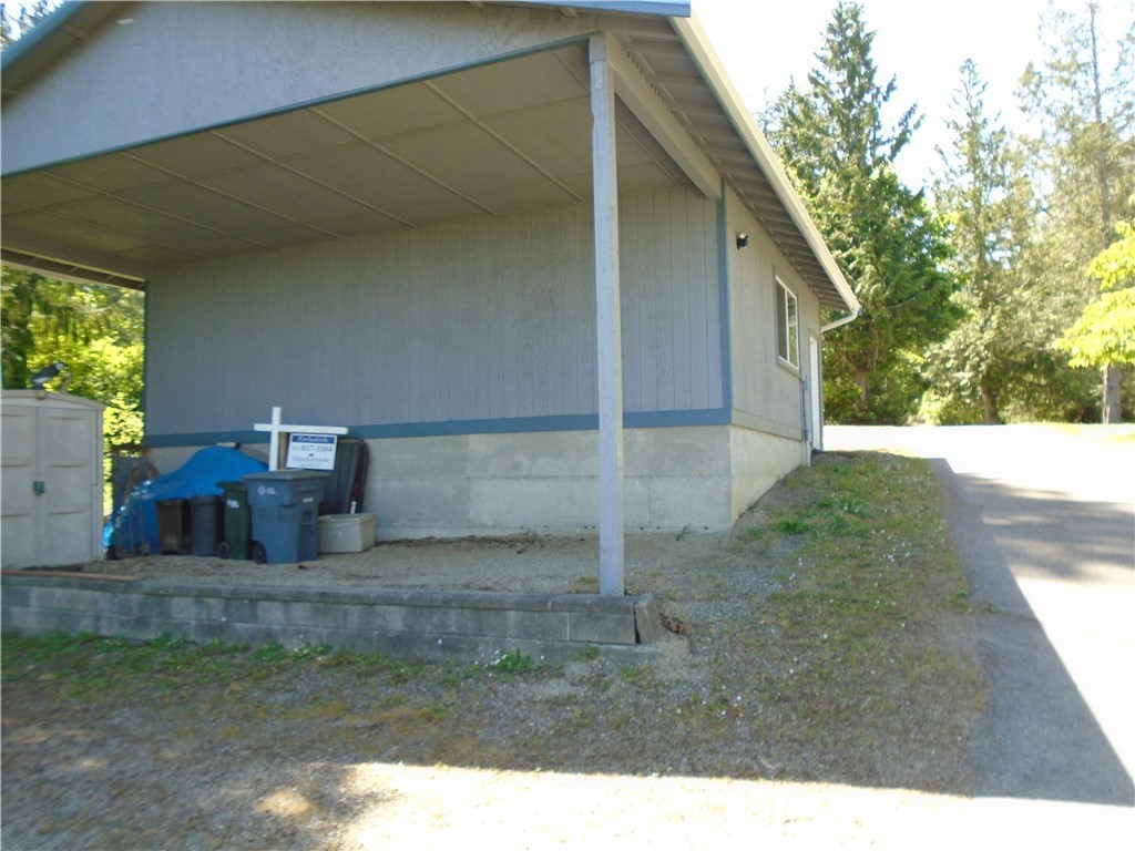 6219 Yeazell Road Southwest Longbranch, WA 98351 - Photo 15 of 27 a backyard of a house with lots of green space