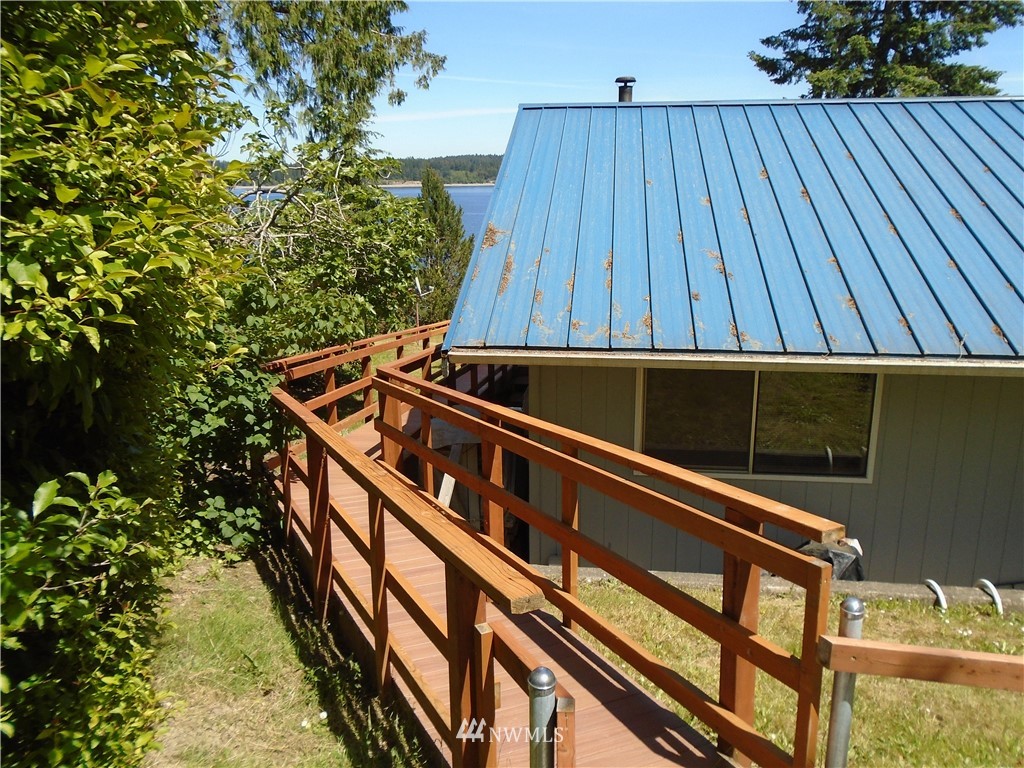6219 Yeazell Road Southwest Longbranch, WA 98351 - Photo 3 of 27 a view of balcony with wooden floor
