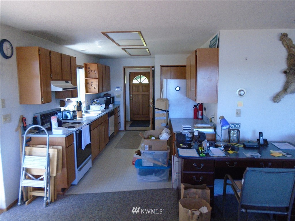 6219 Yeazell Road Southwest Longbranch, WA 98351 - Photo 7 of 27 a living room with furniture and a dining table
