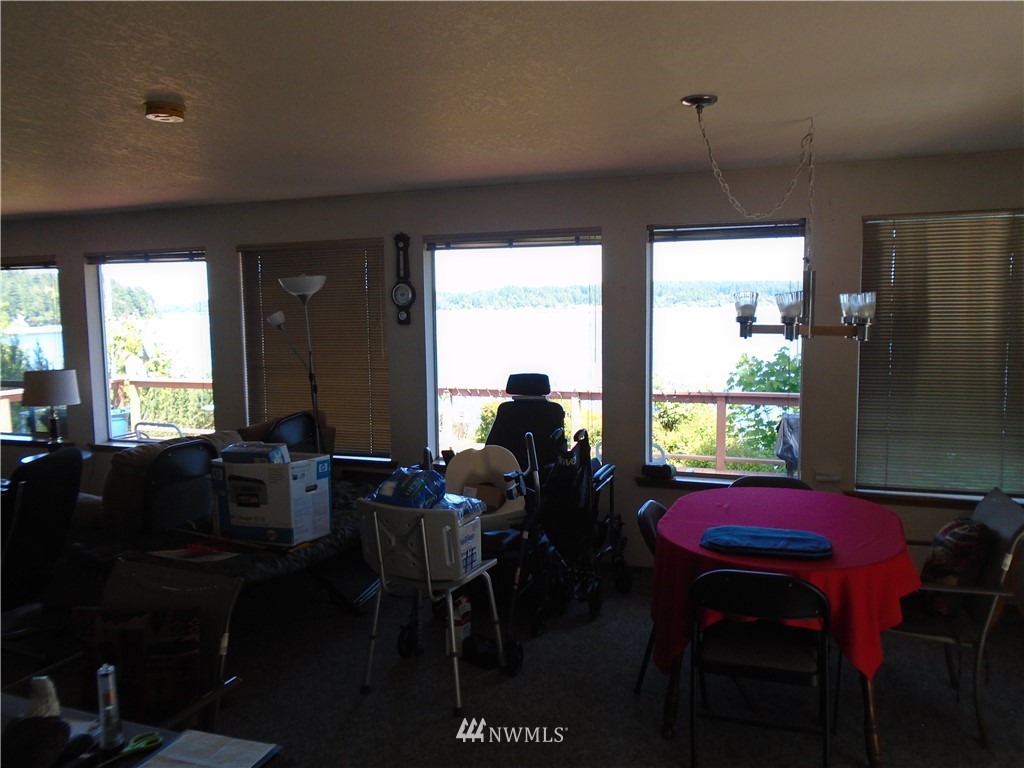 6219 Yeazell Road Southwest Longbranch, WA 98351 - Photo 8 of 27 a view of a dining room with furniture window and outside view
