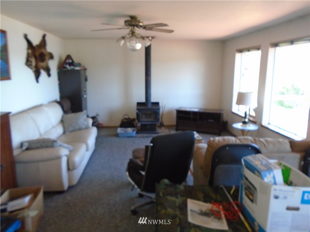 6219 Yeazell Road Southwest Longbranch, WA 98351 - Photo 9 of 27 a living room with furniture and a window