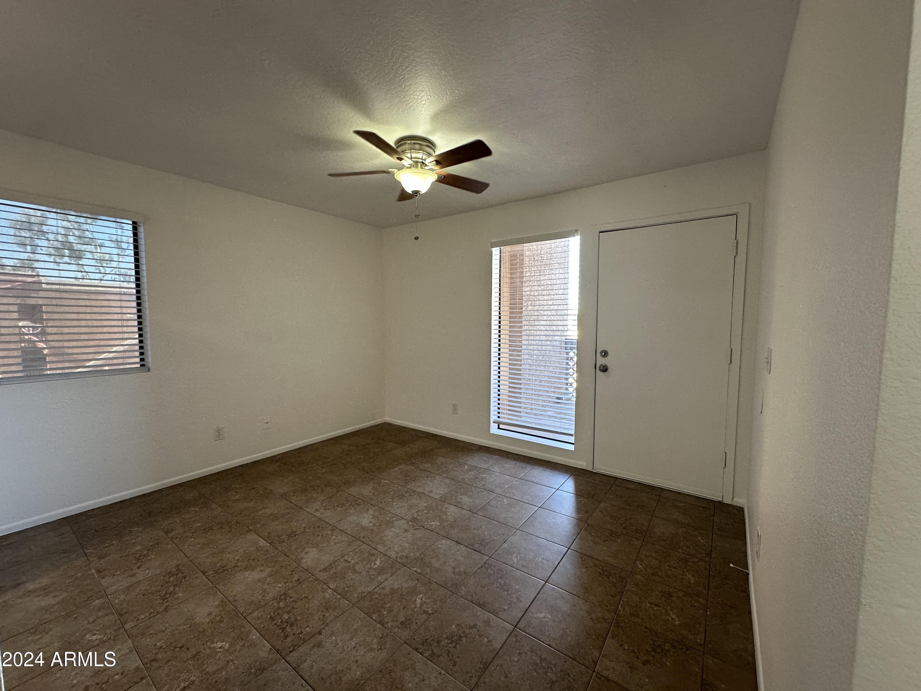 2650 East McKellips Road, Unit 204 Mesa, AZ 85213 - Photo 12 of 13 a view of an empty room with a window