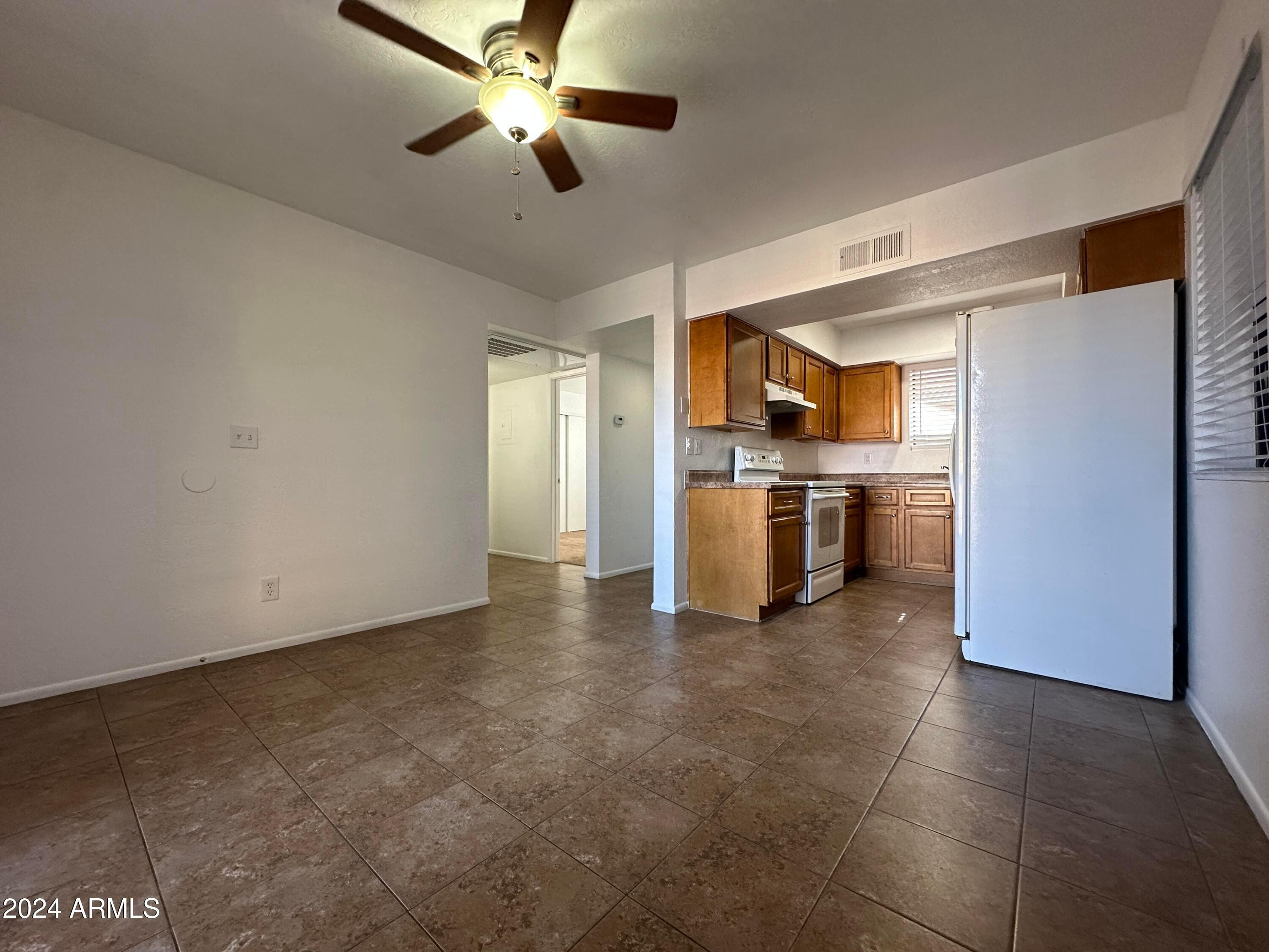 2650 East McKellips Road, Unit 204 Mesa, AZ 85213 - Photo 7 of 13 a view of a kitchen with a sink stainless steel appliances and cabinets
