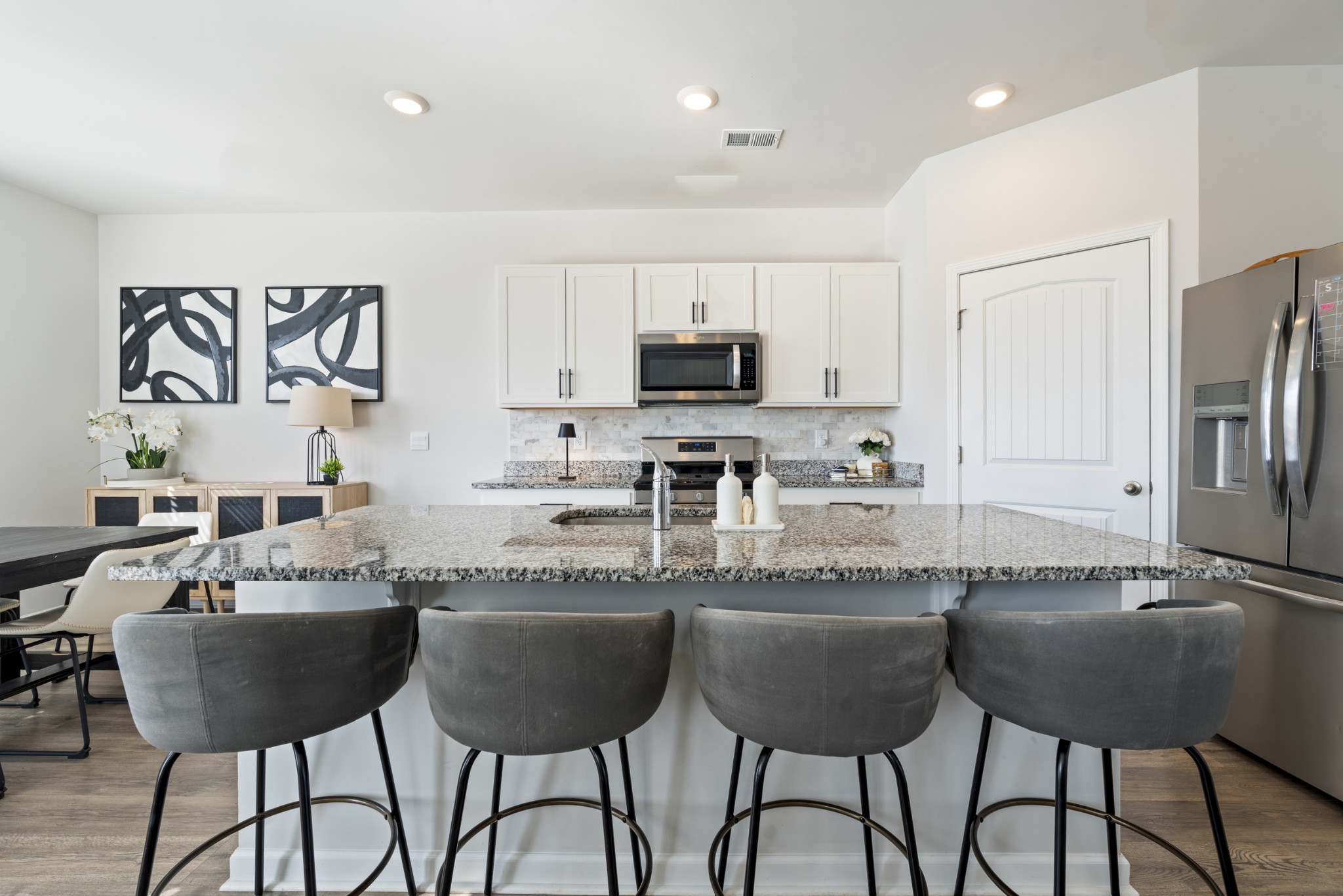 2301 Tintern Road Lebanon, TN 37087 - Photo 12 of 56 a kitchen with granite countertop a dining table and chairs