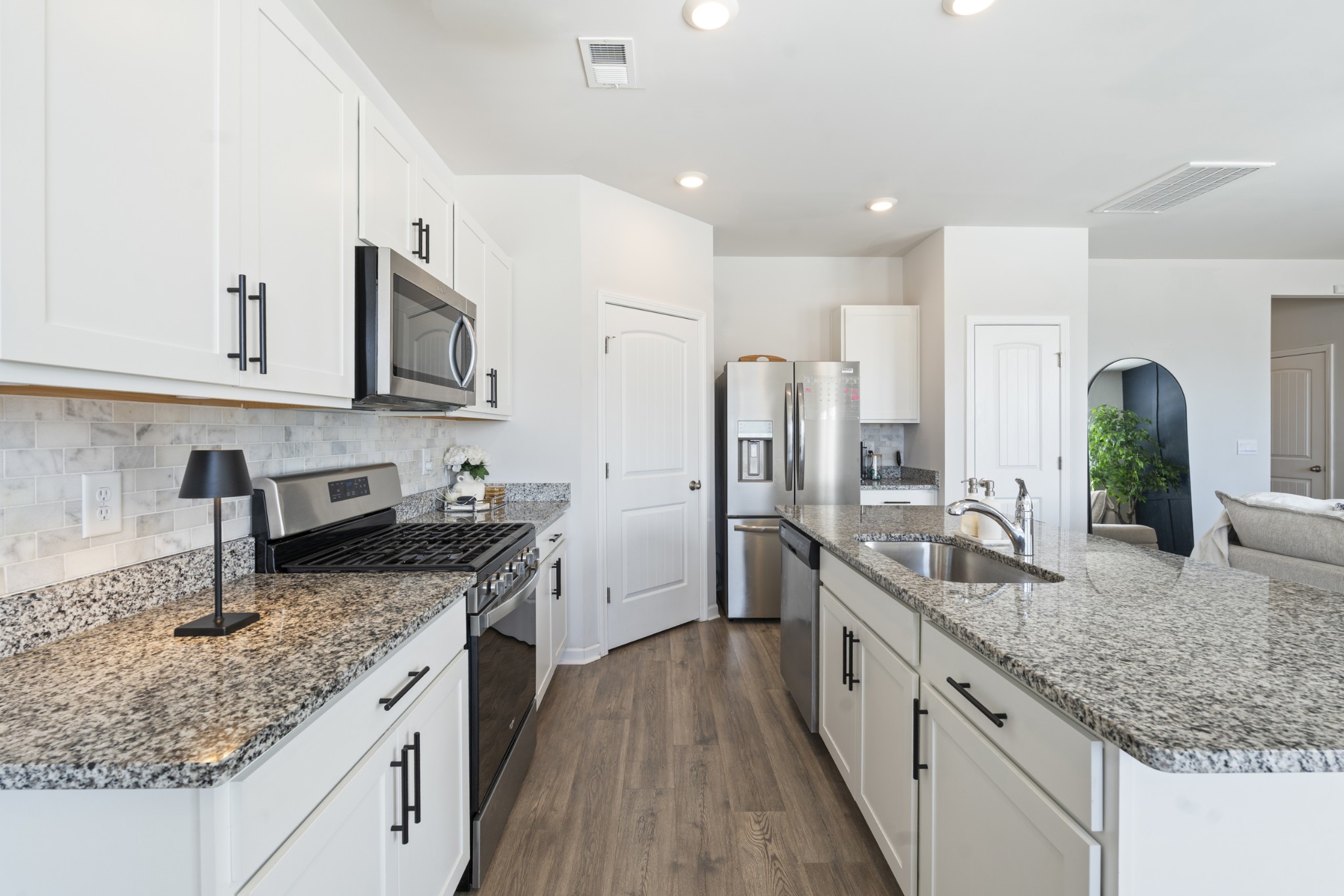 2301 Tintern Road Lebanon, TN 37087 - Photo 15 of 56 a kitchen with stainless steel appliances granite countertop a sink stove and refrigerator