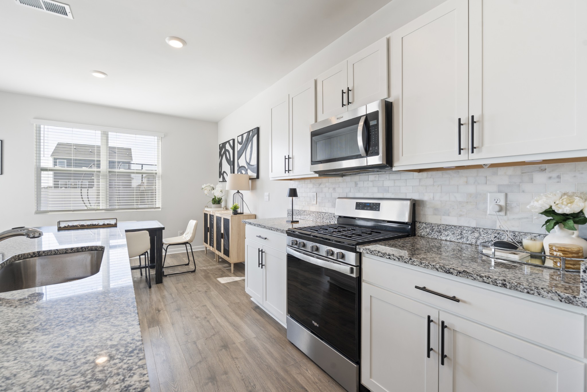 2301 Tintern Road Lebanon, TN 37087 - Photo 19 of 56 a kitchen with stainless steel appliances granite countertop a stove a sink and a microwave
