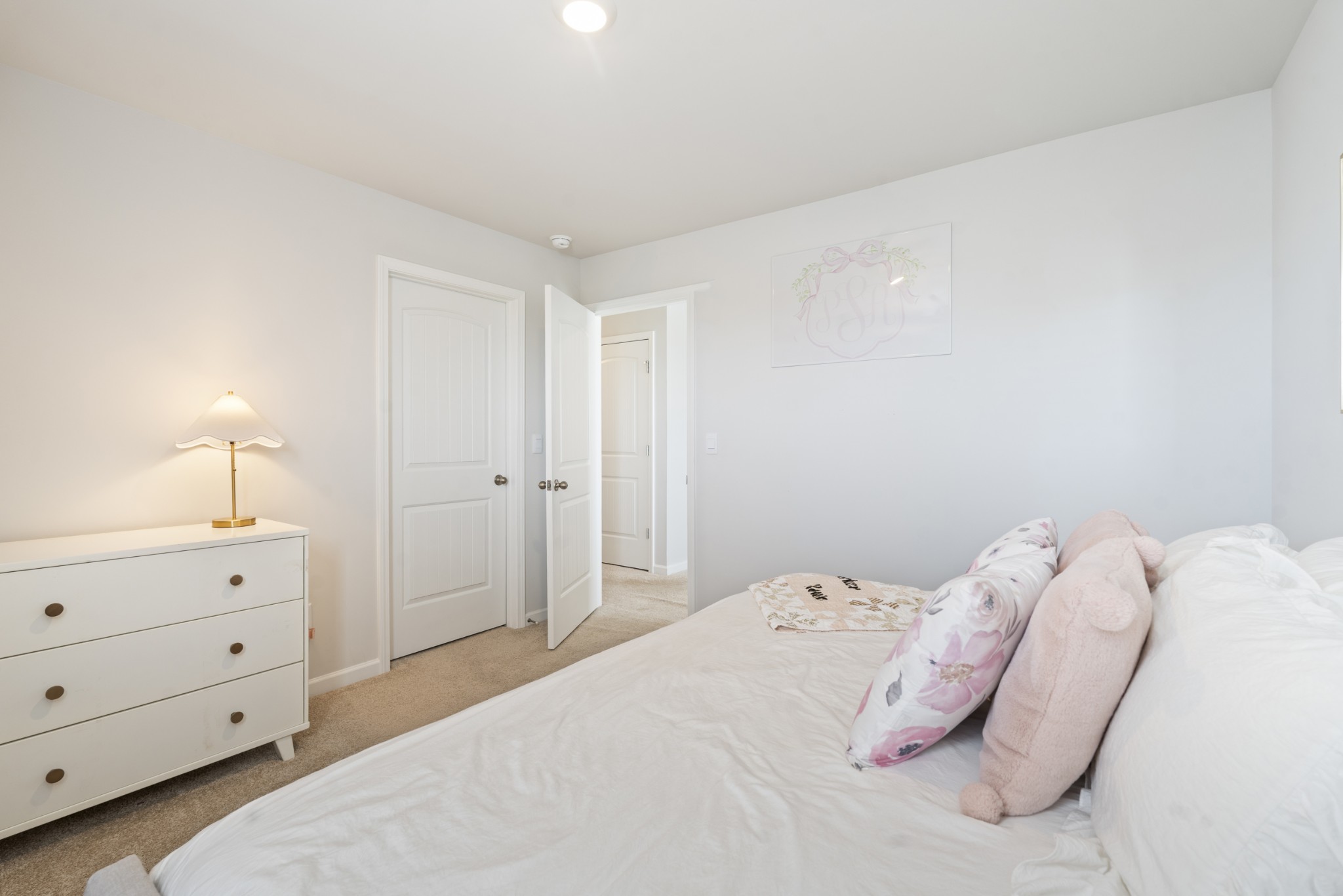 2301 Tintern Road Lebanon, TN 37087 - Photo 30 of 56 a bedroom with a bed and a lamp on dresser