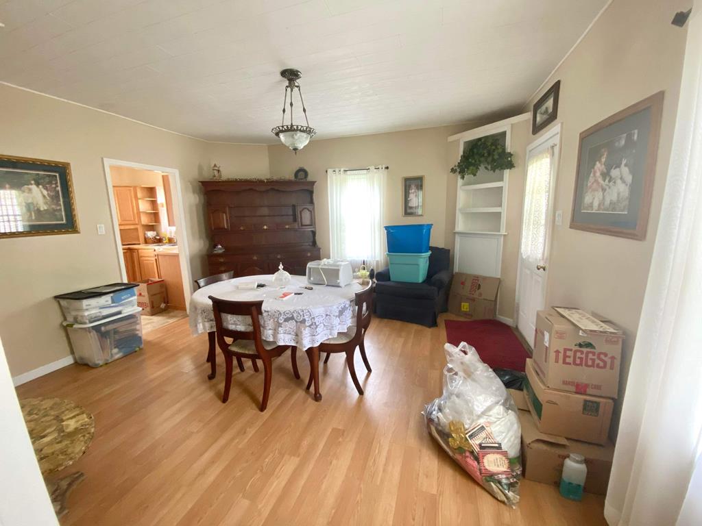 1007 Perryville Road Parker, PA 16049 - Photo 11 of 20 a view of a dining room with furniture window and wooden floor