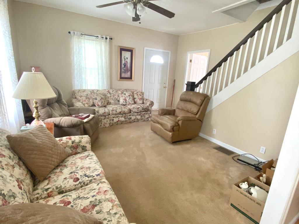 1007 Perryville Road Parker, PA 16049 - Photo 13 of 20 a living room with furniture and a lamp