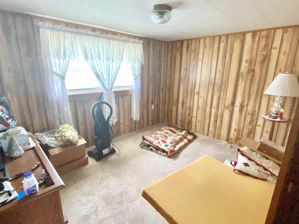 1007 Perryville Road Parker, PA 16049 - Photo 16 of 20 a bedroom with a bed and a dresser
