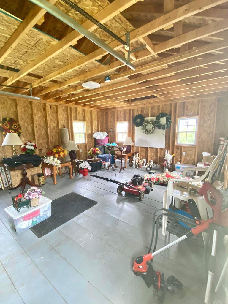 1007 Perryville Road Parker, PA 16049 - Photo 20 of 20 a living room with lots of furniture and a chandelier