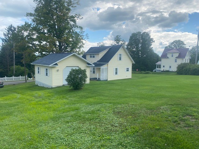 1007 Perryville Road Parker, PA 16049 - Photo 4 of 20 a view of a white house with a big yard and large trees