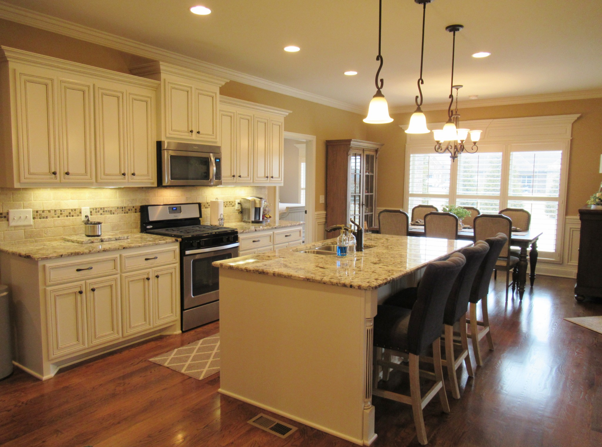 445 Huntington Drive Lebanon, TN 37087 - Photo 11 of 50 a kitchen with microwave a sink and chairs