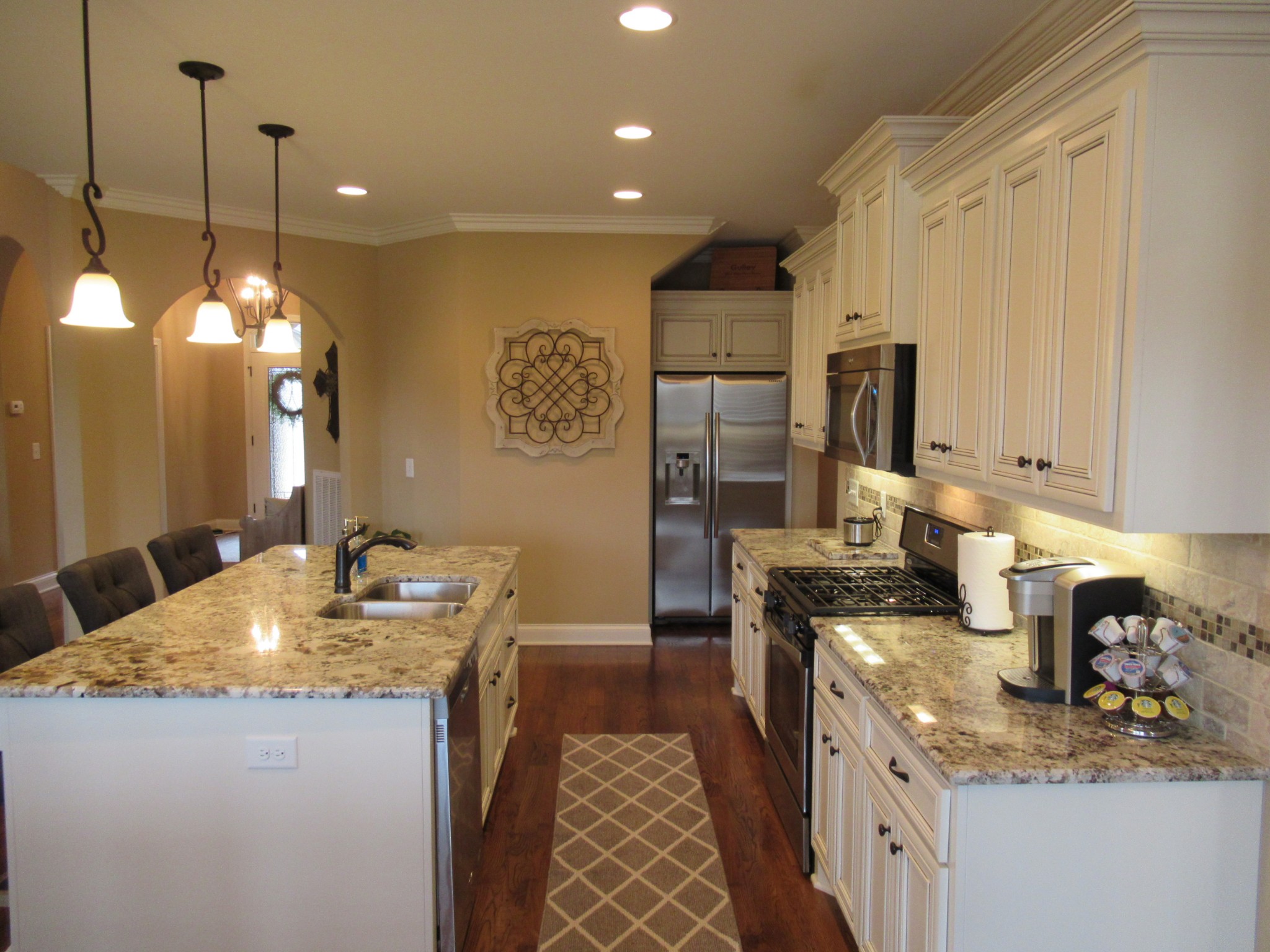 445 Huntington Drive Lebanon, TN 37087 - Photo 12 of 50 a kitchen with stainless steel appliances granite countertop a sink stove and refrigerator