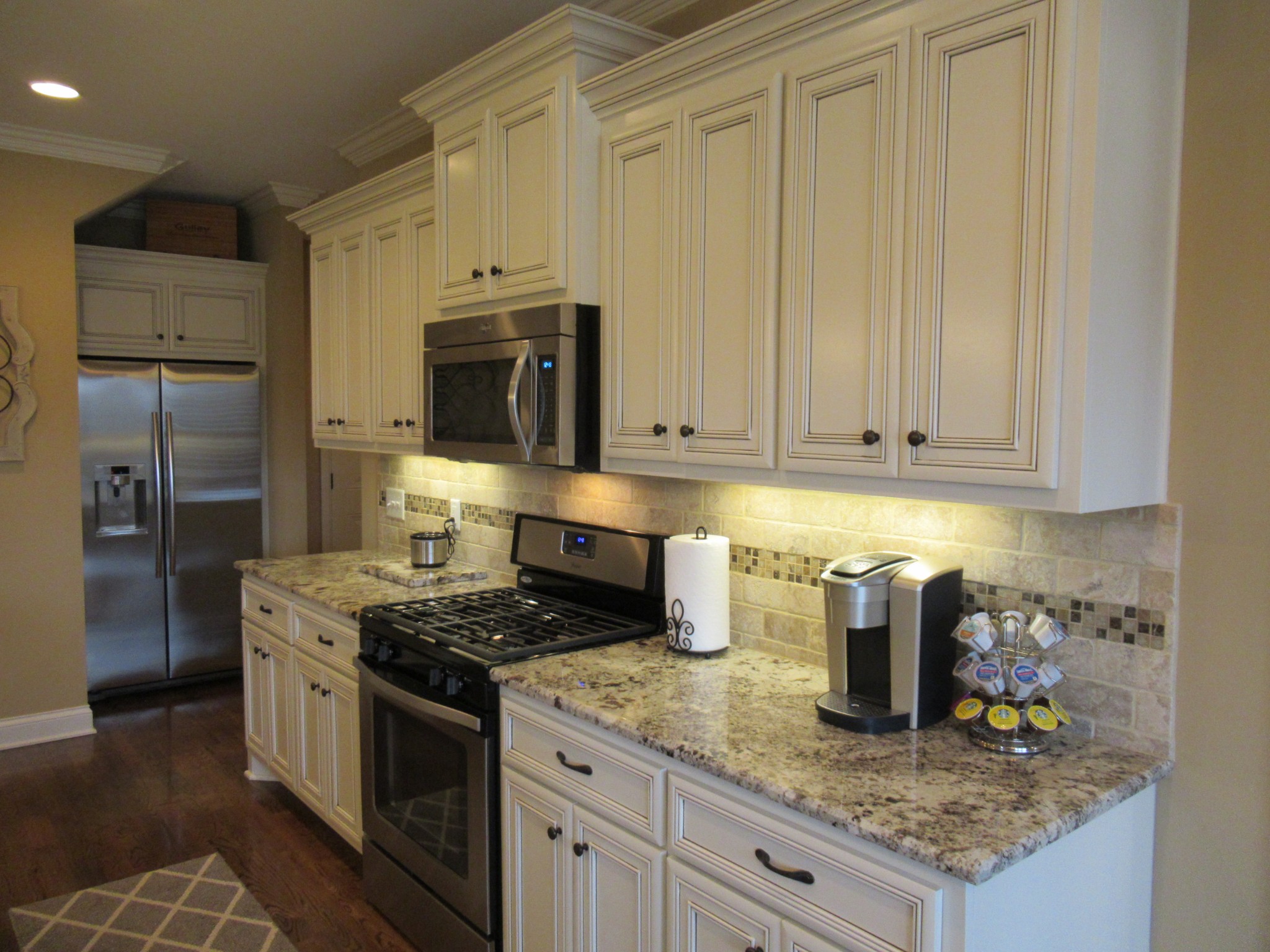 445 Huntington Drive Lebanon, TN 37087 - Photo 13 of 50 a kitchen with granite countertop a sink stainless steel appliances and cabinets