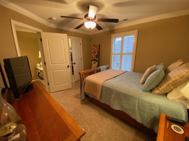 445 Huntington Drive Lebanon, TN 37087 - Photo 35 of 50 a bedroom with a bed and a chandelier