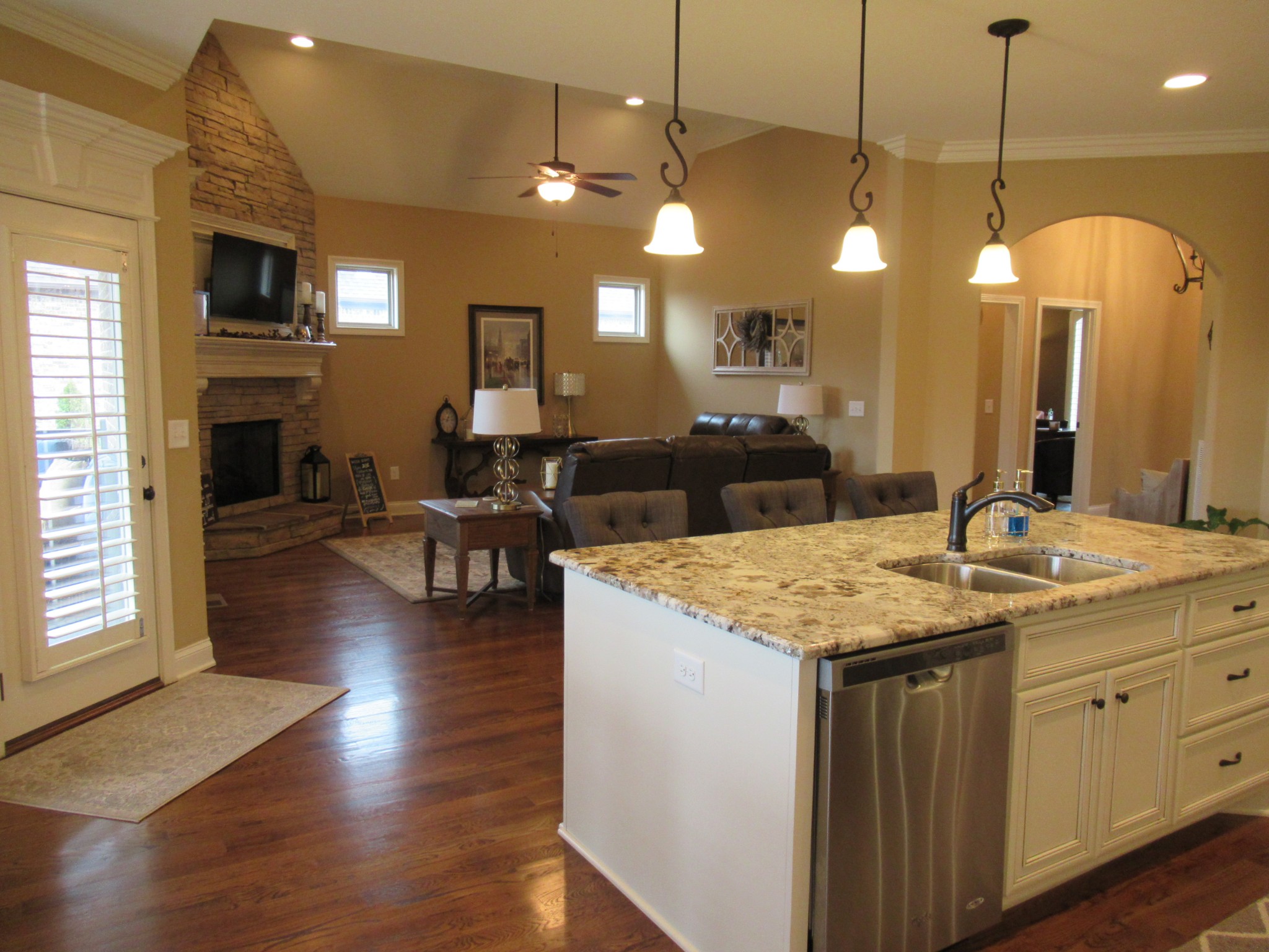 445 Huntington Drive Lebanon, TN 37087 - Photo 10 of 50 a view of a kitchen counter space a sink wooden floor and a chandelier