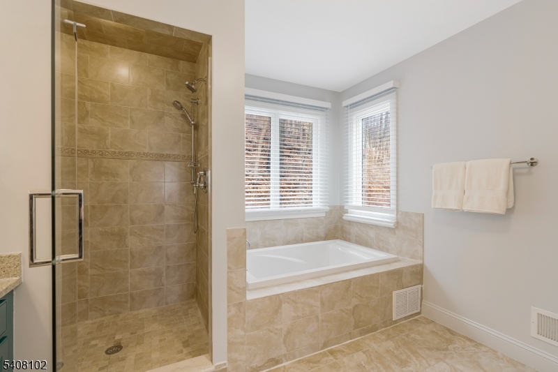 5 Ridge Road Warren, NJ 07059 - Photo 22 of 39 a spacious bathroom with a bathtub and shower
