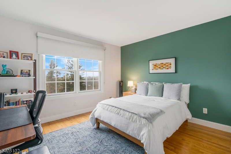 5 Ridge Road Warren, NJ 07059 - Photo 25 of 39 a bedroom with a bed a table and chair