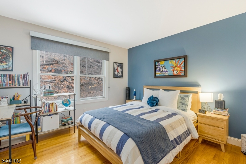 5 Ridge Road Warren, NJ 07059 - Photo 26 of 39 a bedroom with a bed and a painting on the wall