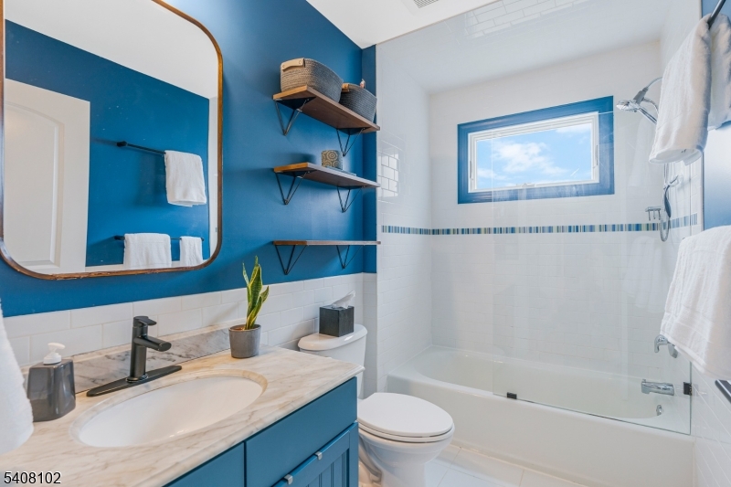 5 Ridge Road Warren, NJ 07059 - Photo 27 of 39 a bathroom with a sink a toilet and shower