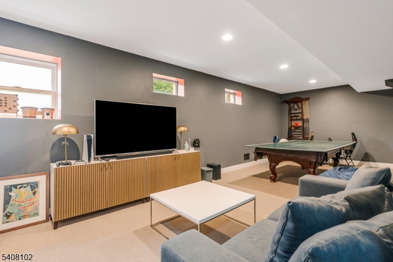 5 Ridge Road Warren, NJ 07059 - Photo 29 of 39 a living room with furniture and a flat screen tv
