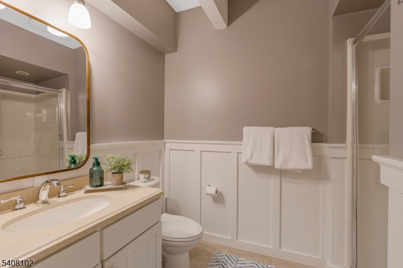 5 Ridge Road Warren, NJ 07059 - Photo 31 of 39 a bathroom with a granite countertop sink toilet and mirror