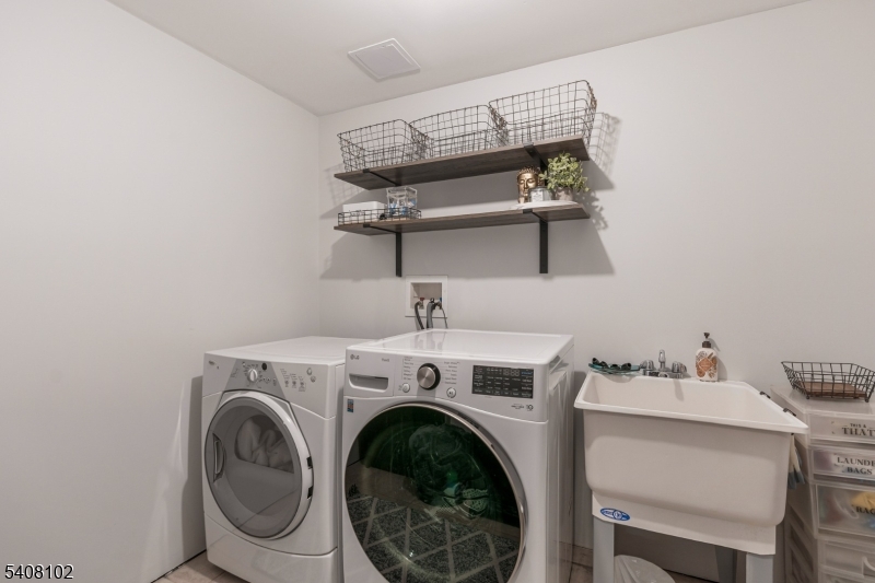 5 Ridge Road Warren, NJ 07059 - Photo 33 of 39 a utility room with dryer and washer