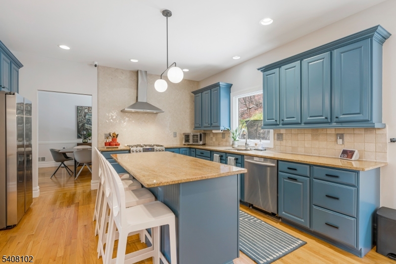 5 Ridge Road Warren, NJ 07059 - Photo 9 of 39 a kitchen with stainless steel appliances granite countertop a sink a stove and a refrigerator