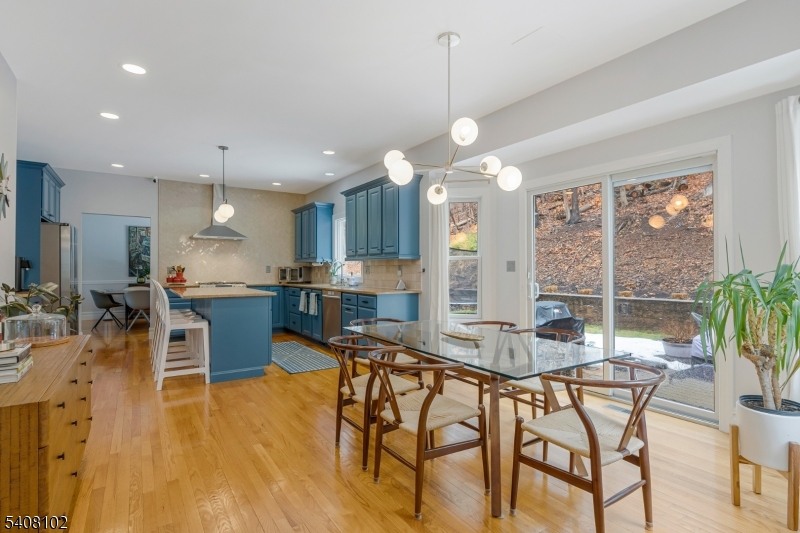5 Ridge Road Warren, NJ 07059 - Photo 10 of 39 a view of a dining room and livingroom with furniture wooden floor a chandelier