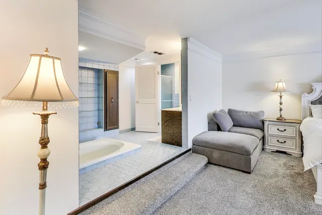 a living room with furniture and a lamp