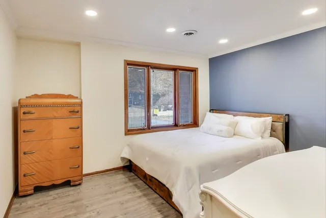 a bedroom with a bed and a dresser