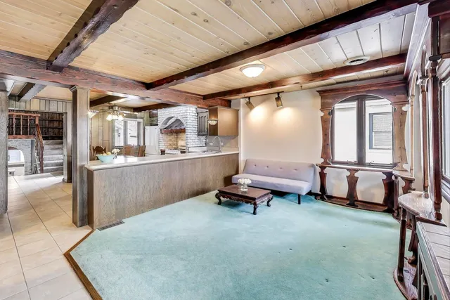 a living room with a couch and a window