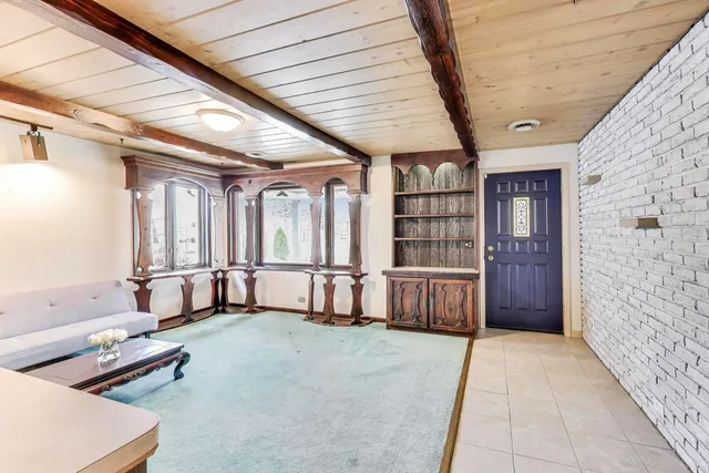 a dining room filled with furniture and window