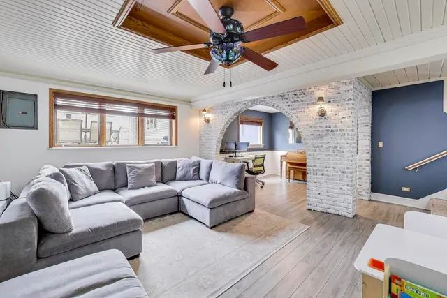 a living room with furniture and a fireplace