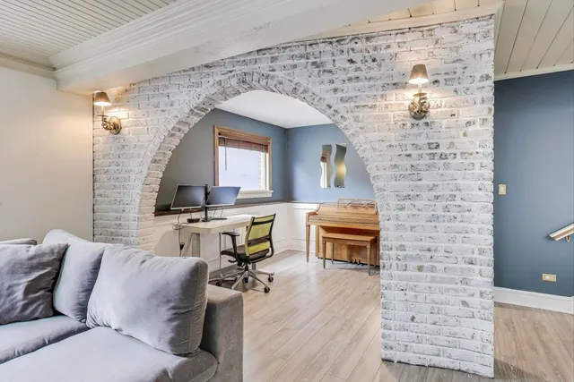 a living room with furniture and a fireplace