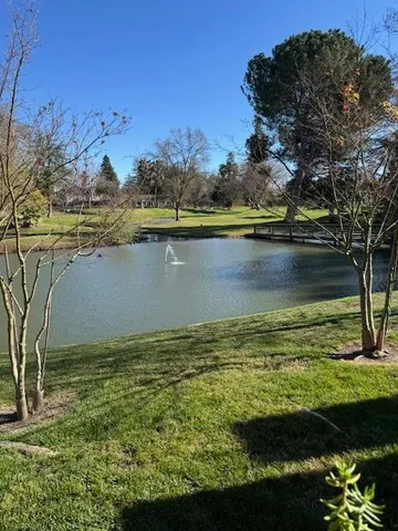 a view of a lake with a yard